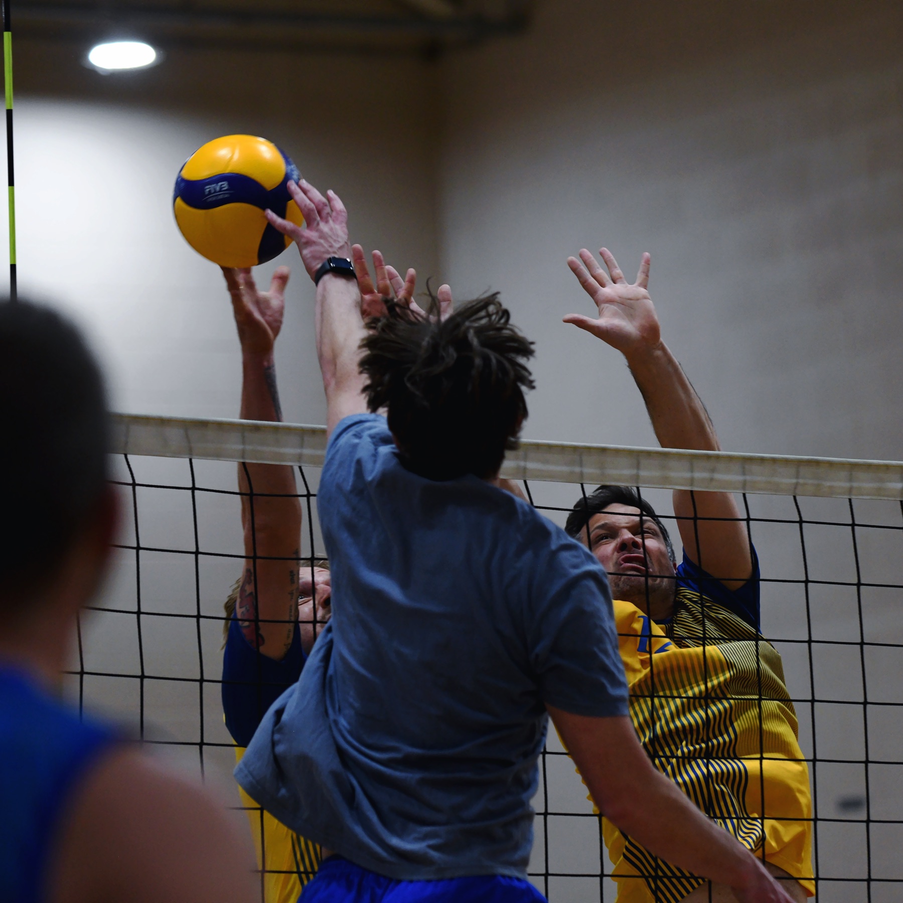 A double block at the net against the opposing attack